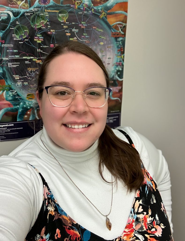 Photo of Kaitlyn Grando, a white femme-presenting, approximately 30 year-old