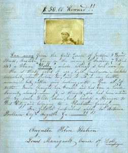 Hand written warrant with photograph of a runaway slave, (linked to larger version).