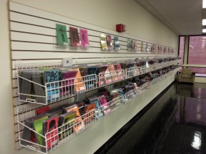 DVD cases in a wire rack lining the wall in the Media Services center.