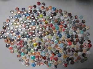 300 promotional buttons spread out on a table.