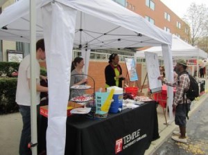 Volunteers at an open air table during the TU Fest.