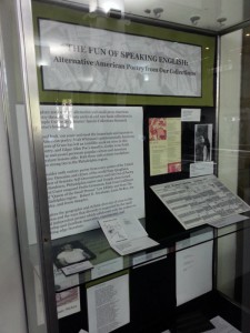 Glass display case in library with texts and photos for the Alternative American Poetry exhibition (links to larger version).