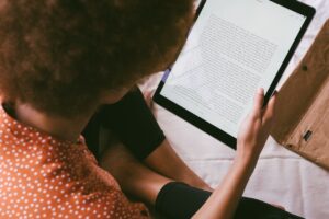 High Angle Photo of Person Reading an E-Book
