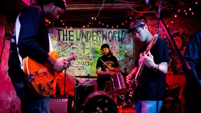 A band playing in the basement at The Underworld. Cred. Noel Chacko, The Temple News.
