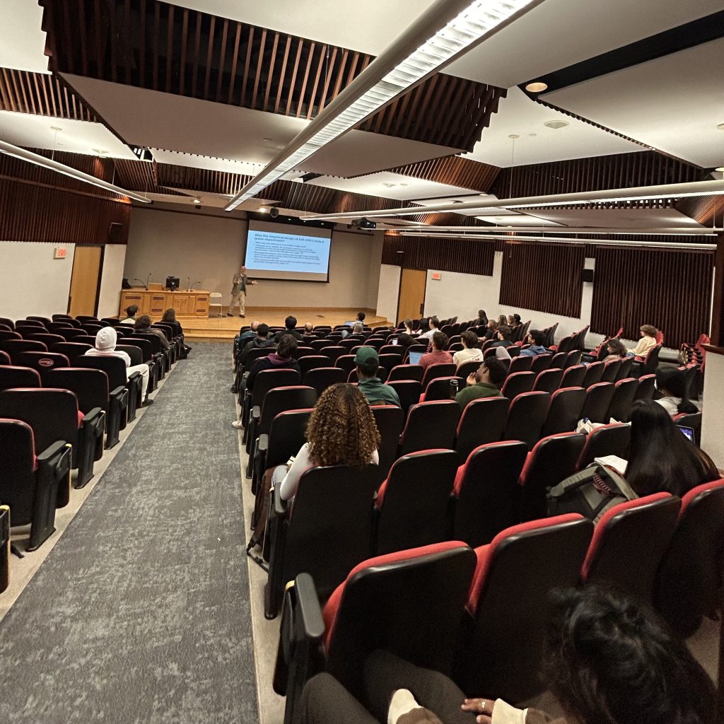 Professor Diamantaras lecturing, seen from the back of the auditorium