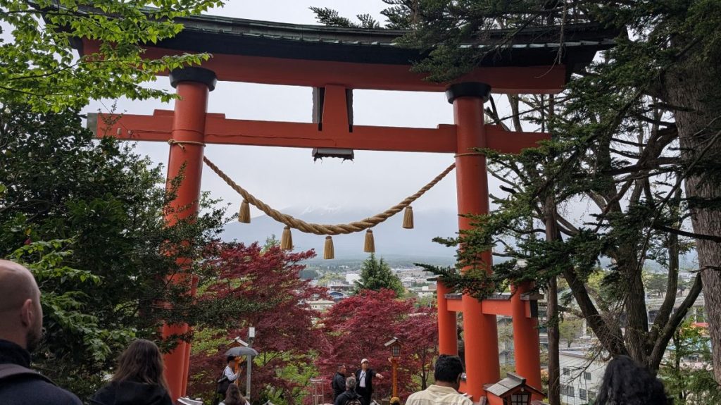 Shinto gate overlooking Mt Fuji obscured by clouds 