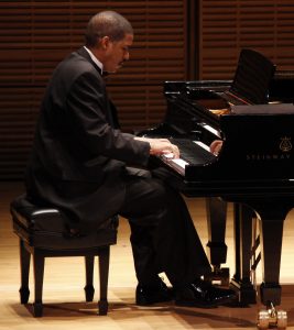 Photo of Dr. Fluellen playing the piano.