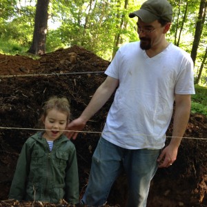 Retaining wall project, Summer 2015, with June as gauge for measuring trench depth.