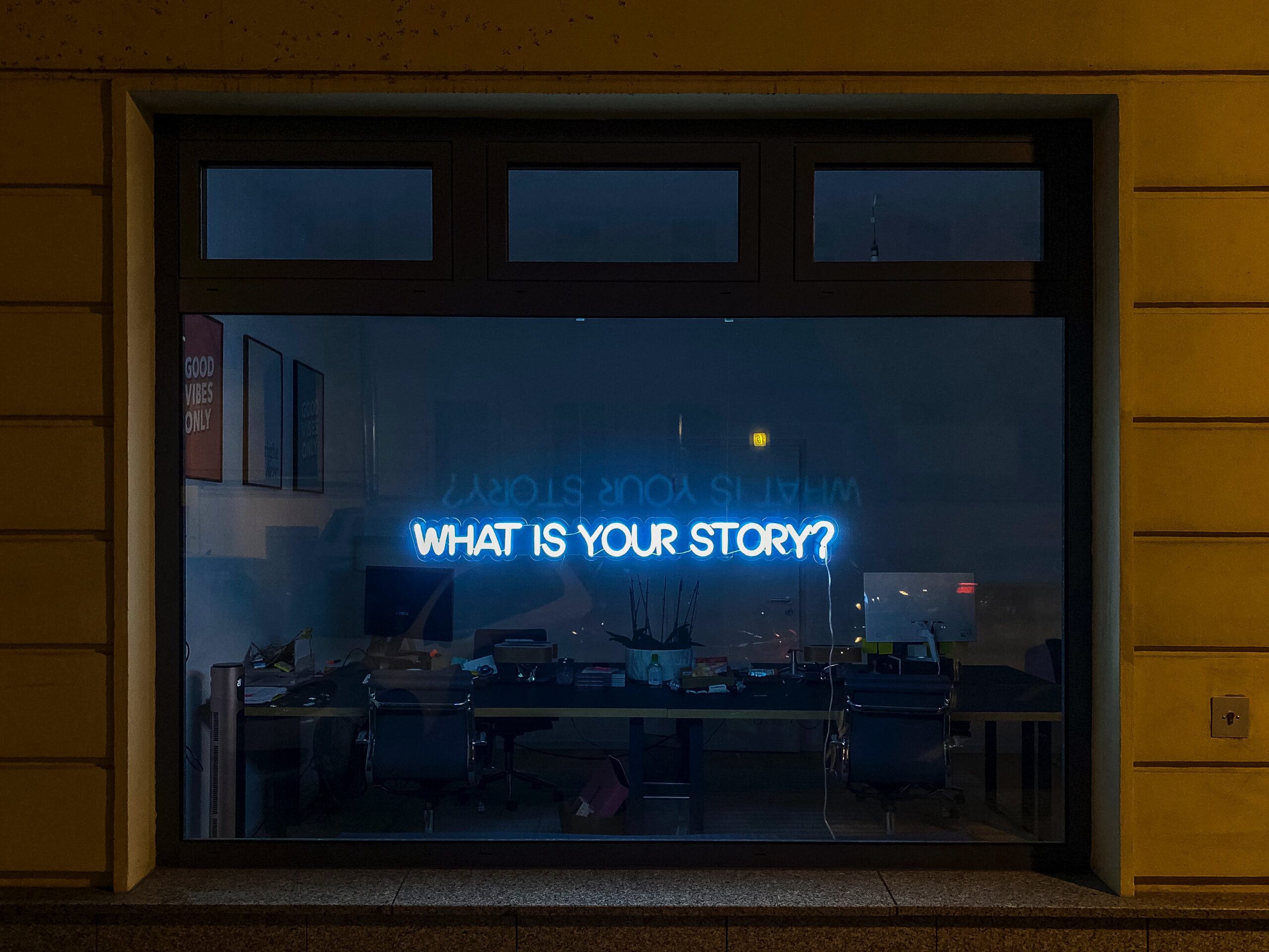 A window that says "what is your story?"
