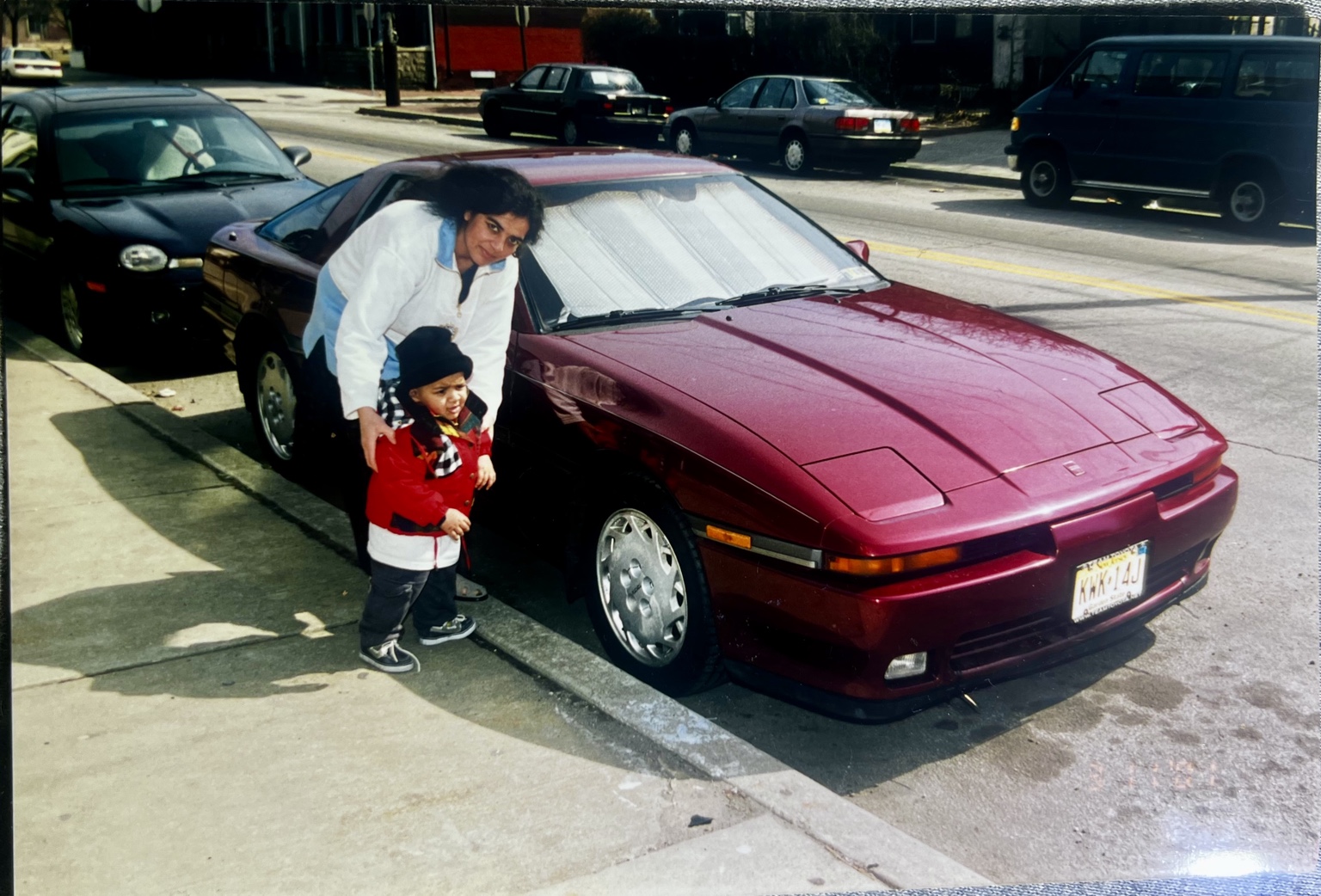 My mother and I next to our family car