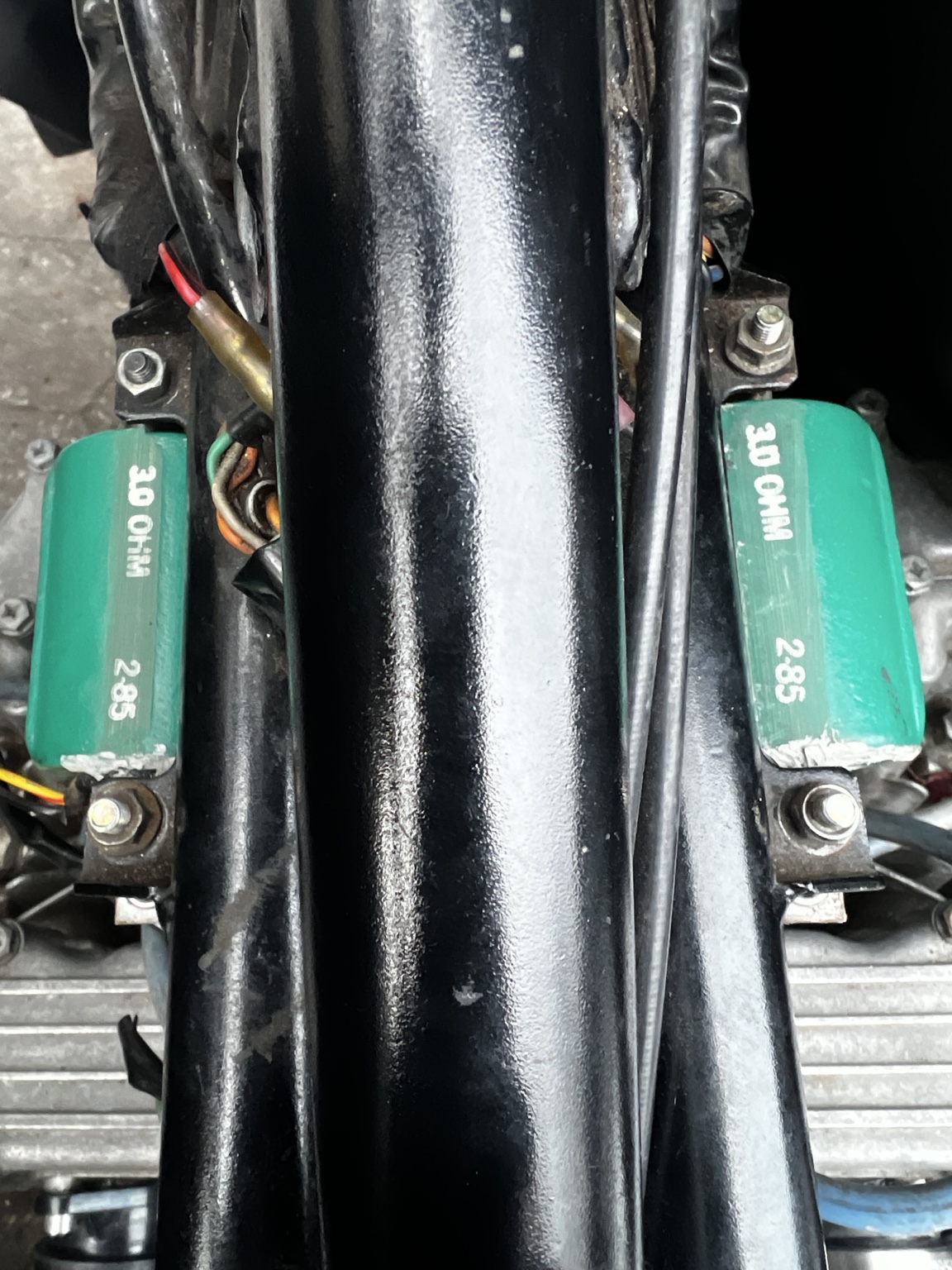 Two green Dyna ignition coils mounted along the KZ650 frame.