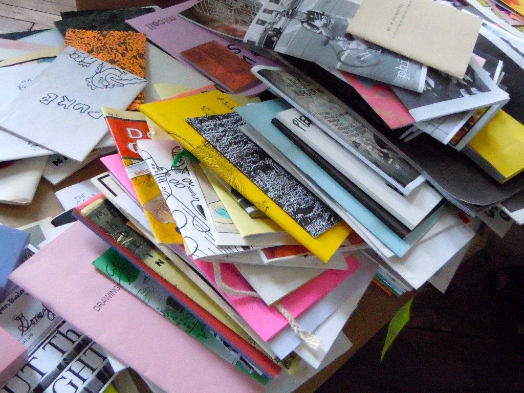 Stacks of zines.