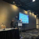 RCL Research Coordinator Caseem Luck presenting findings on attitudes towards genetic testing among diverse cancer populations at a symposium within the Society for Behavioral Medicine Conference, 2024
